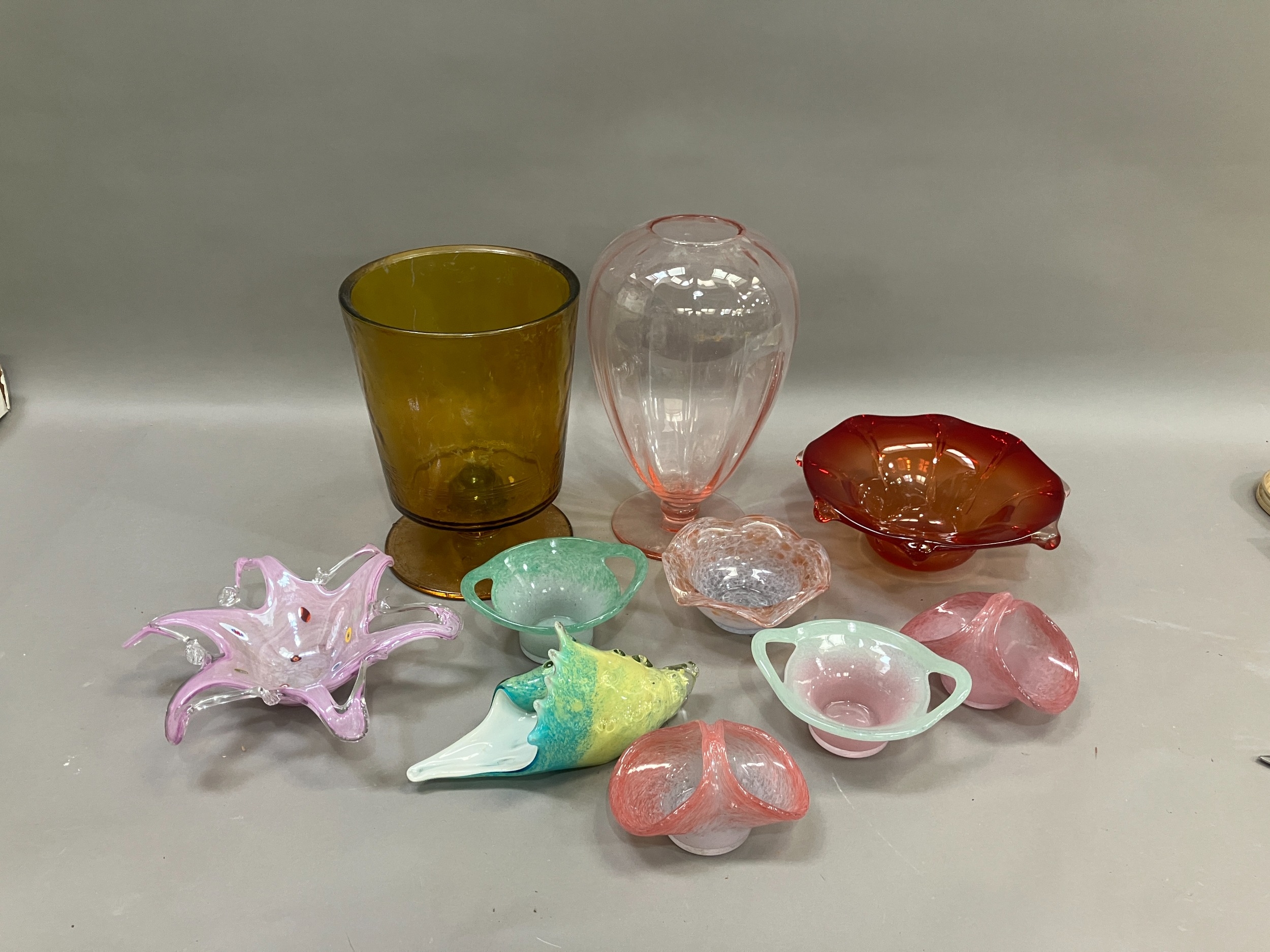 A collection of art glass comprising pierced basket, pierced table centre piece with floral