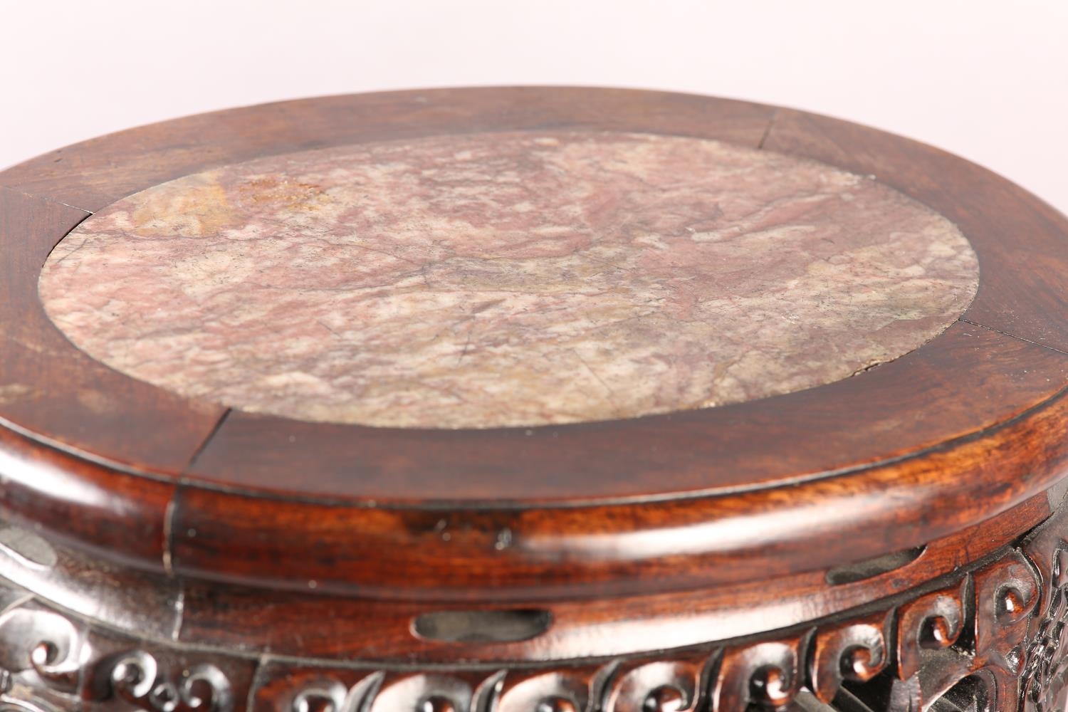 A 19th century Chinese hardwood and marble inset urn stand, of oval outline, the apron pierced and - Image 5 of 5