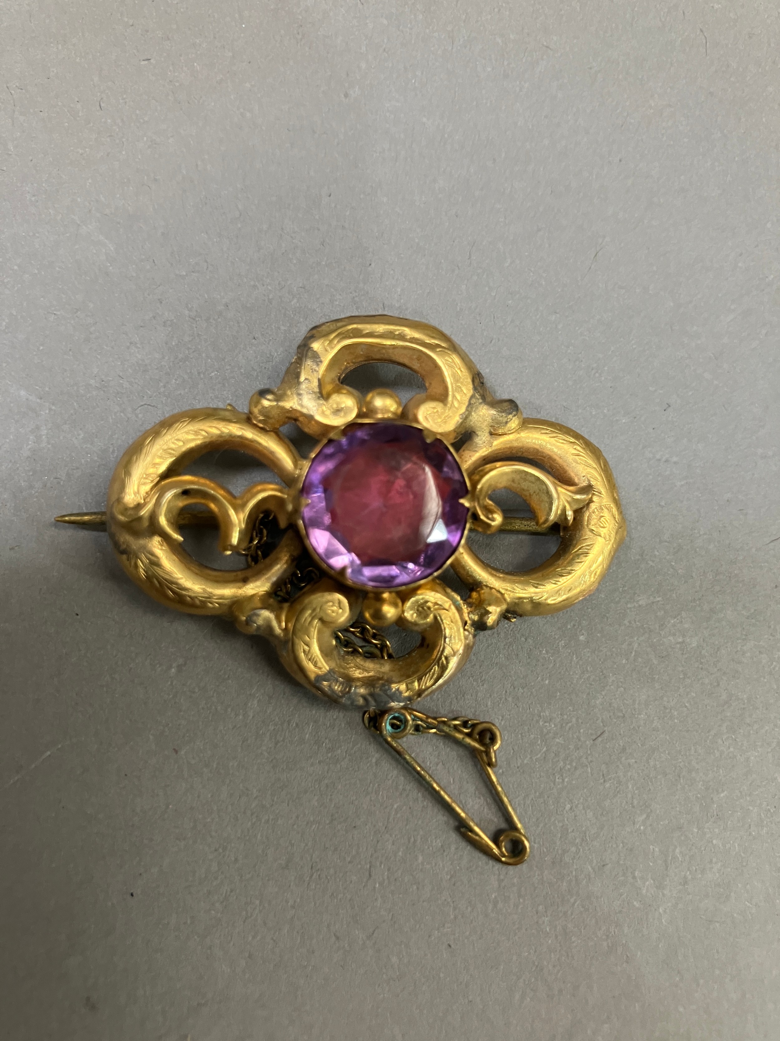 A Victorian amethyst set knot brooch in 9ct gold A/F with base metal repairs, together with an early - Image 2 of 4