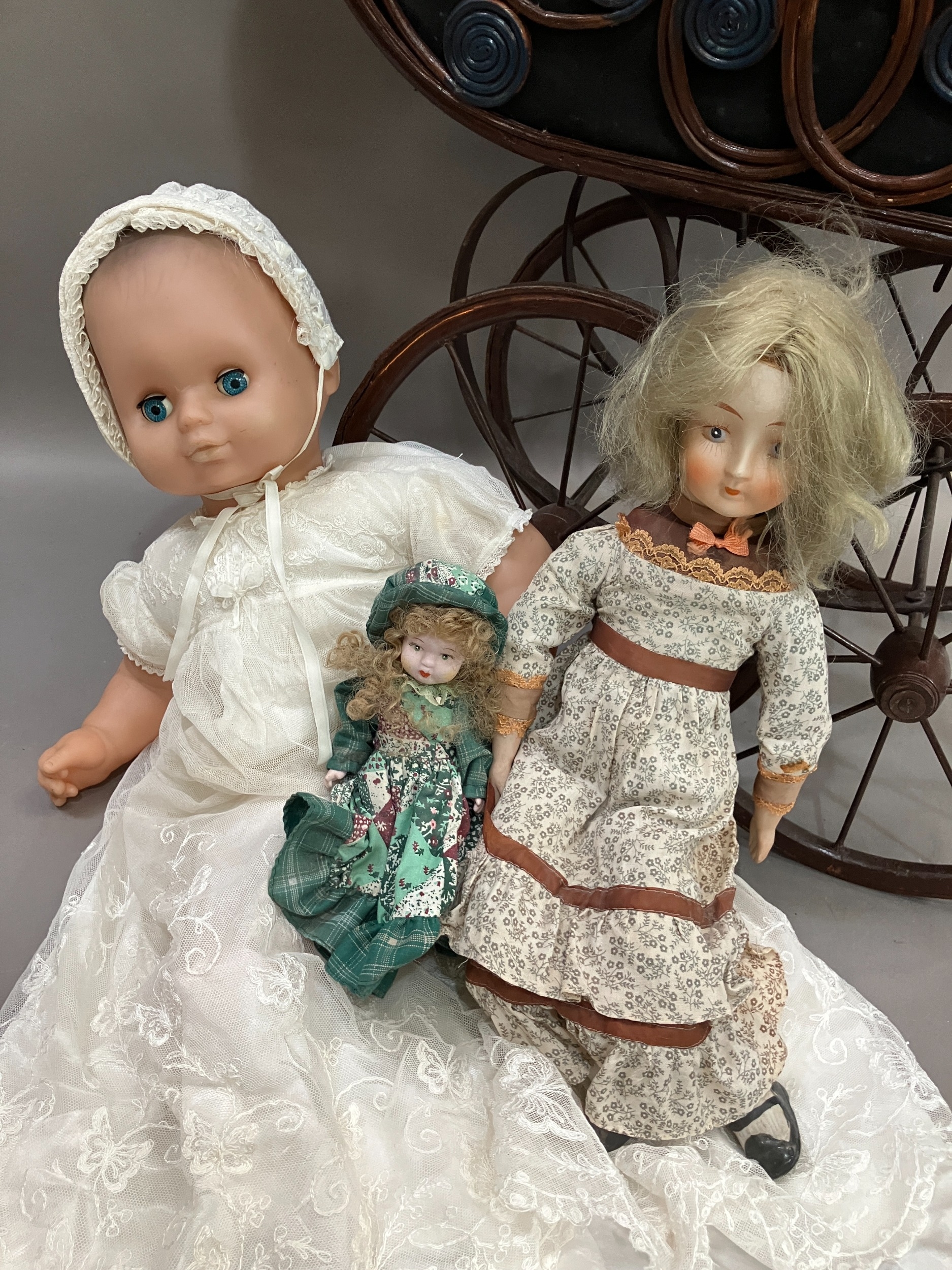 Two dolls with porcelain heads and limbs, jointed bodies and together with a modern realistic doll - Image 3 of 3