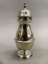 A silver castor of baluster form, 20cm high, approximate weight 6.5oz, London 1913