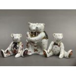 A Royal Crown Derby model of two bears hugging together with two seated bears, 9cm and 6.5cm