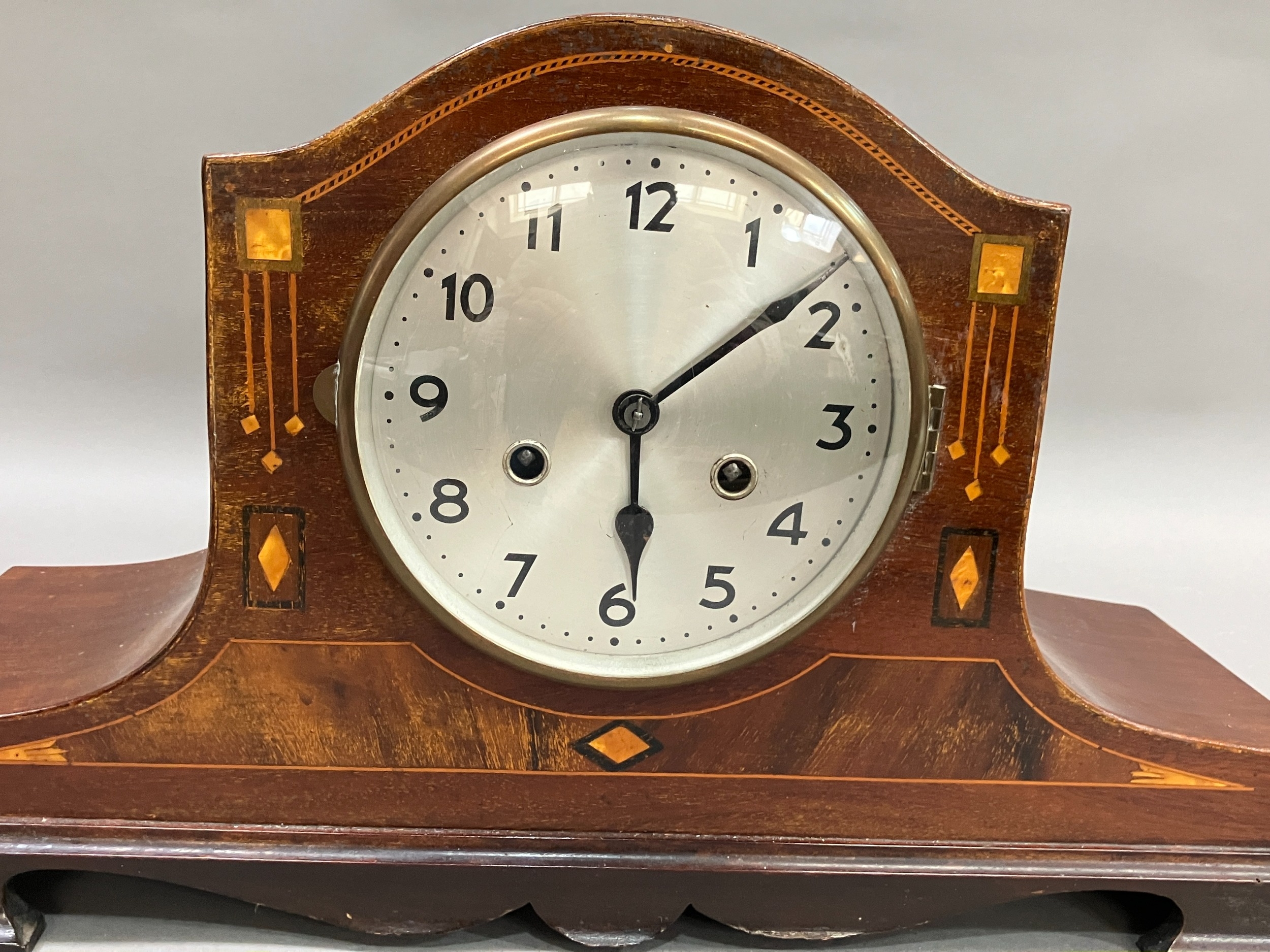 An early 20th century mahogany and inlaid mantel clock having silvered dial with black Arabic - Image 2 of 3