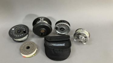 Four fly fishing reels to include, two Magnum 200D, one Romfly with extra reel, one Pflueger
