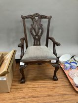 A reproduction 18th century open armchair with carved top rail and pierced splat, apron and splat,