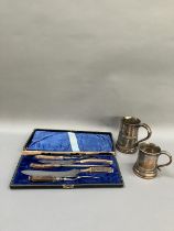 A five piece horn handled carving set in fitted case together with two 19th century Sheffield