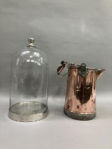 A 19th century copper watering can 35cm high together with a glass dome having metal base and handle