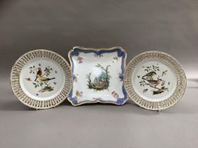 A pair of 19th century Meissen porcelain plates, polychrome painted with birds perched on leafy