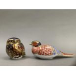 A Royal Crown Derby owl and pheasant paperweight, gold button to one, 8cm and 6.5cm high