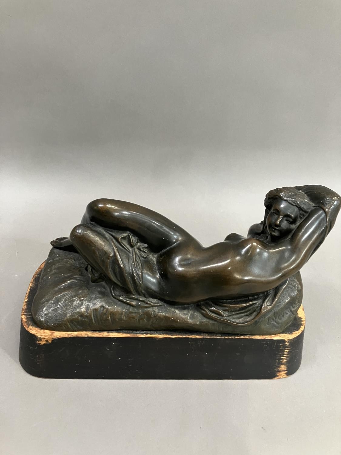 A cast bronze model of a nude woman reclining, indistinctly signed on base 26cm long - Image 2 of 5
