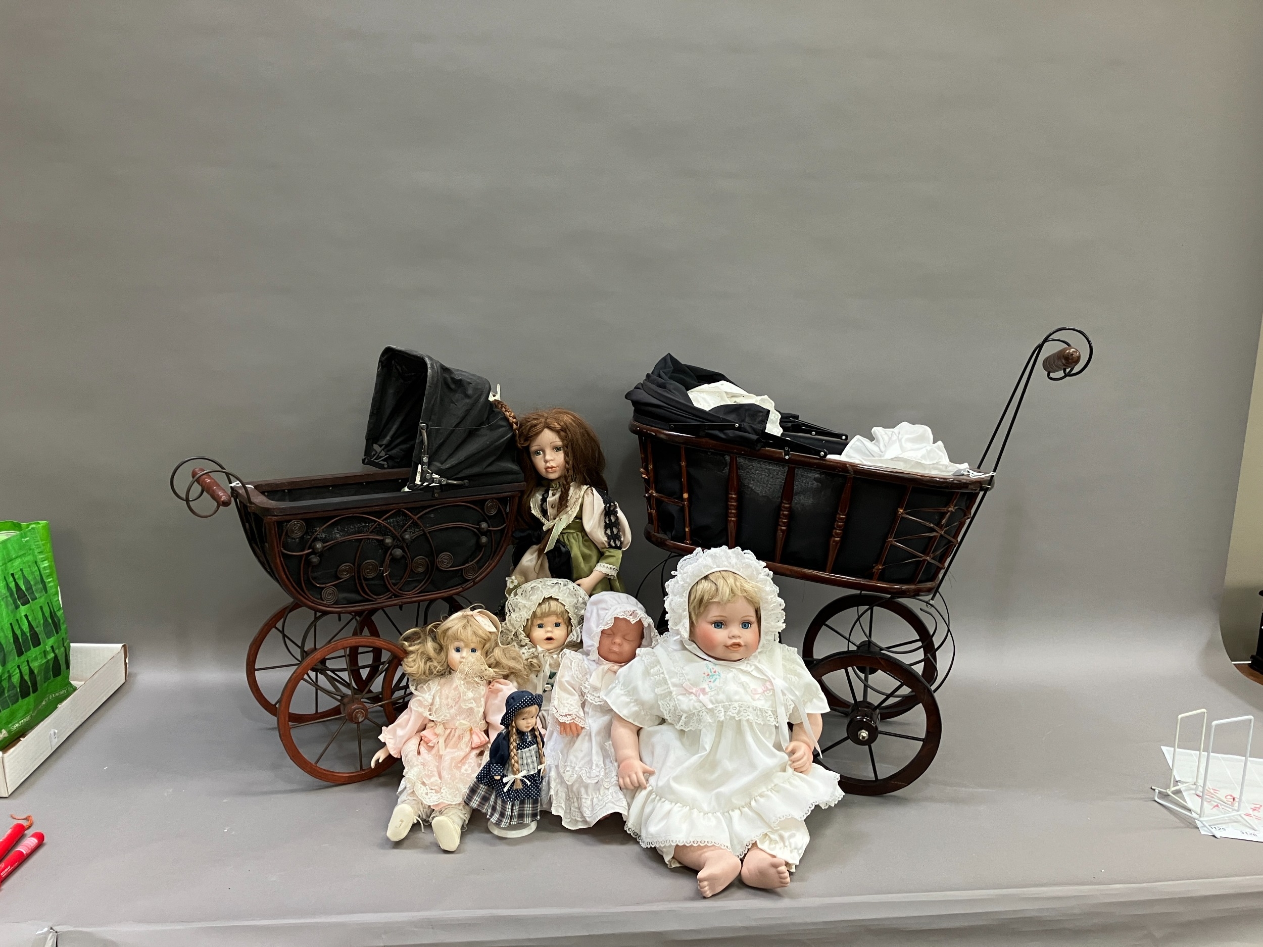 A collection of six modern porcelain dolls in costume, together with two Victorian style prams - Image 2 of 4