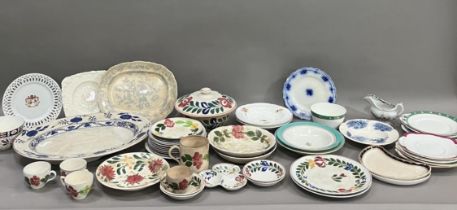 A part pottery service painted with stylised flowers including tureen, plates in different sizes,