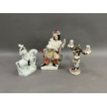 A 19th century German china two light candelabra raised on a female figure with flowers and