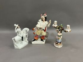 A 19th century German china two light candelabra raised on a female figure with flowers and