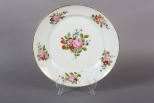 A late 18th century European porcelain plate, polychrome painted with peony and other blossom to the