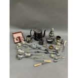 A collection of silver plated ware including sugar sifter, teapot, hot water jug etc