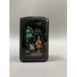A Russian black lacquered trinket box, rectangular, the cover painted with a figure and swan, 8.