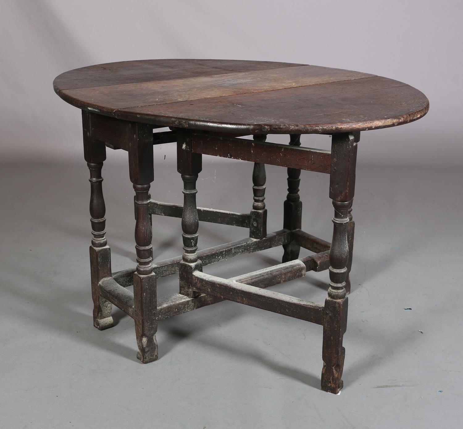An 18th century oak gateleg supper table having twin oval drop leaves on baluster turned and - Image 3 of 4
