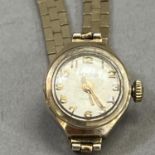 A Roamer lady's manual wrist watch in 9ct gold case on a 9ct gold bracelet, total approximate net