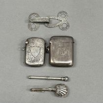 A silver napkin holder London 1999, together with an Edward VII silver composite cloak hook, two