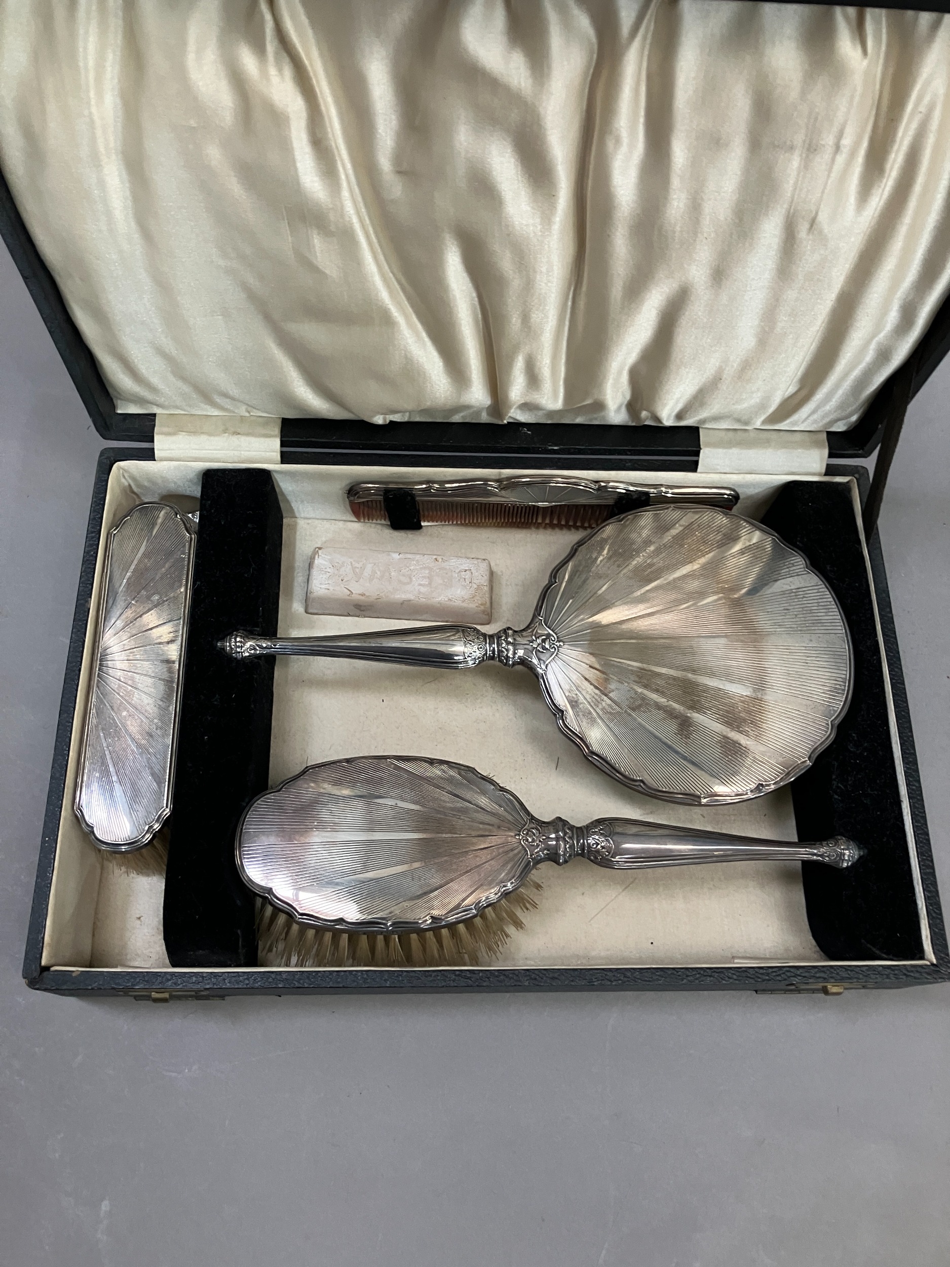 Four piece silver backed dressing table set, Birmingham 1932 in fitted case, comprising hand mirror, - Image 2 of 3