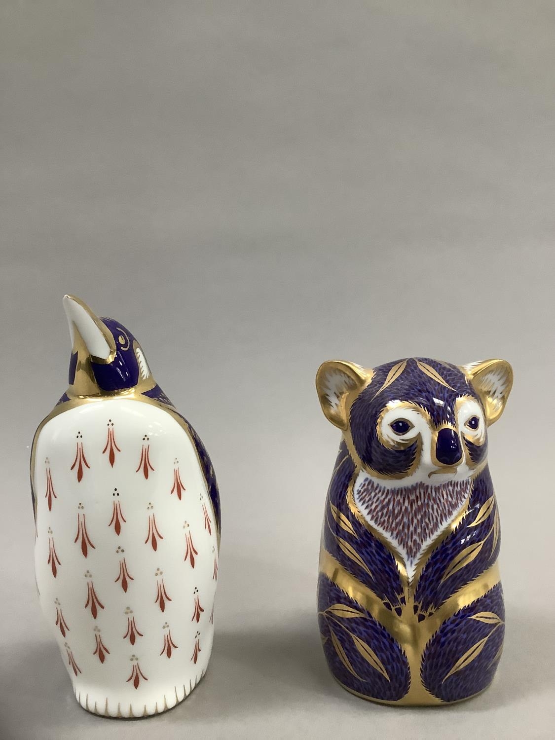 A Royal Crown Derby Koala bear paperweight and a penguin, gold button to one, 11cm and 13.5cm high - Image 2 of 4