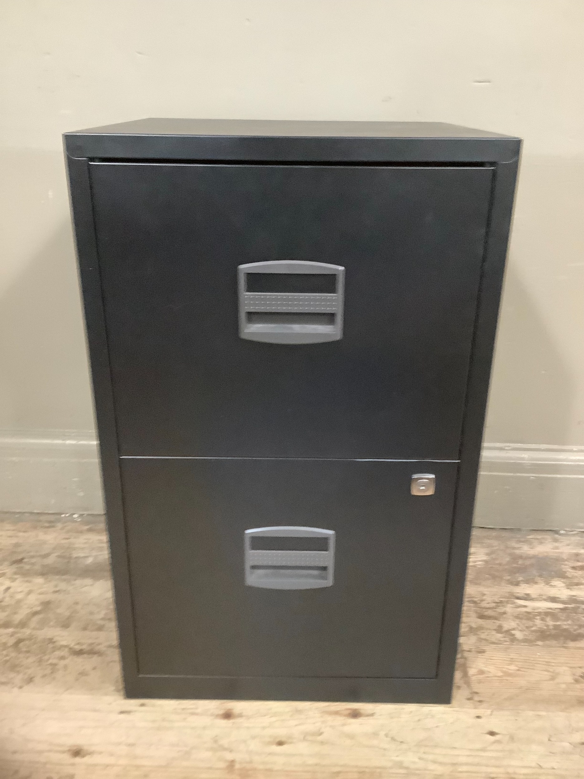 A black two drawer metal filing cabinet