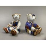 A Royal Crown Derby school girl teddy and school boy teddy, gold buttons, 8.5cm high