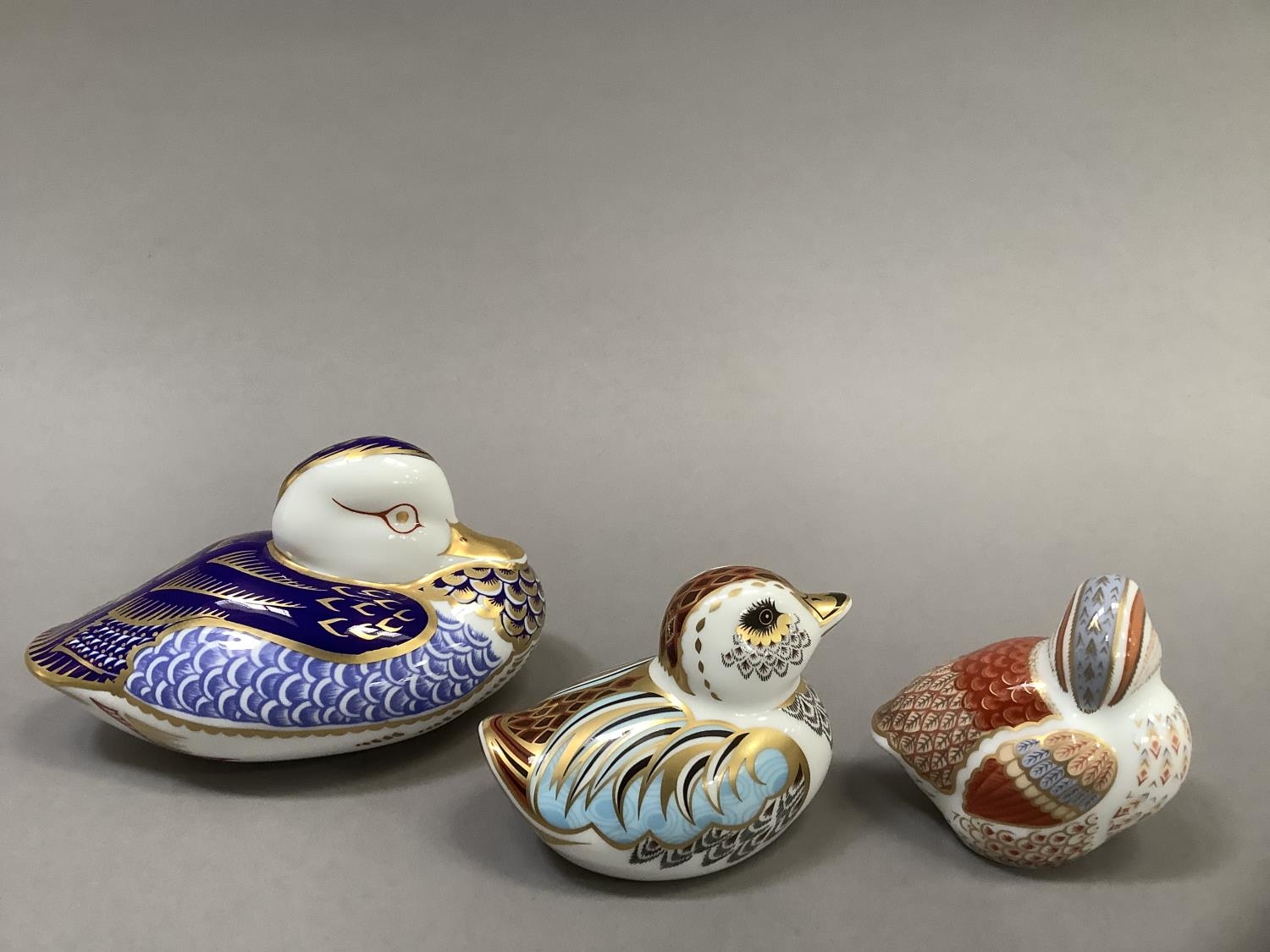 A Royal Crown Derby duck, silver button, collectors guild duckling with gold button and a teal - Image 4 of 5