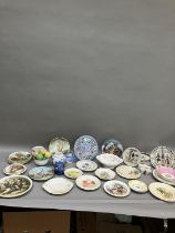 A collection of commemorative and decorative plates including a moulded wall plaque, Ringtons jar