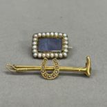 A Victorian seed pearl set stick pin in 15ct gold, the pearl set horse shoe applied to the centre of