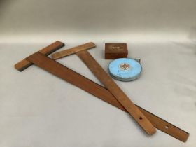 Two T- squares and a mid 20th century Rabone Chesterman tape measure and a box set of scales by J