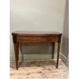 A 19th century mahogany tea table, rectangular having a fold over top with boxwood inlay to the