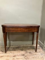 A 19th century mahogany tea table, rectangular having a fold over top with boxwood inlay to the