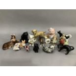 A collection of mainly ceramic animals including dogs, cats, piggy bank, foal, etc