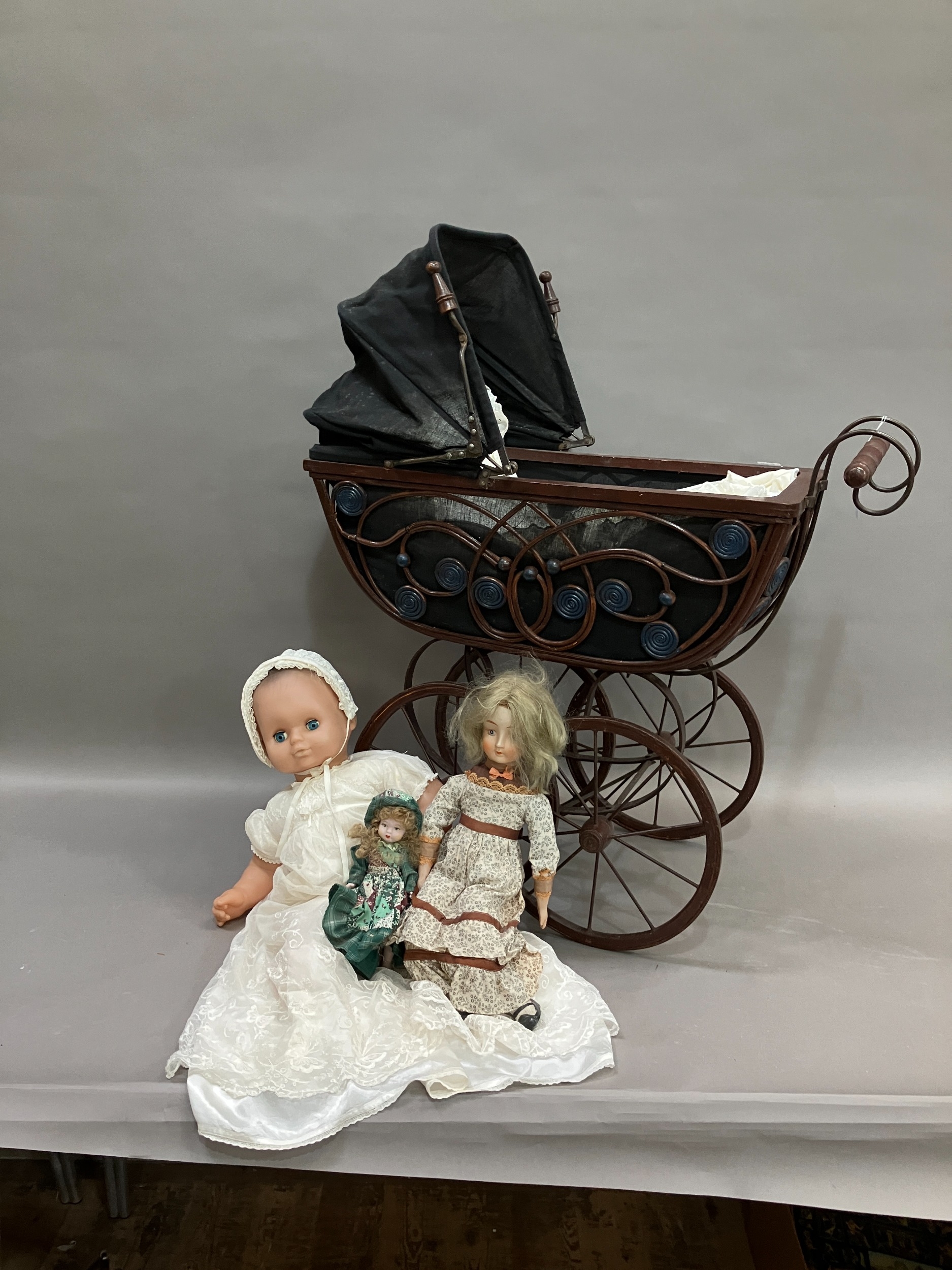 Two dolls with porcelain heads and limbs, jointed bodies and together with a modern realistic doll - Image 2 of 3