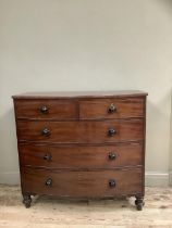 A 19th century mahogany bow front chest of two short and three long graduated drawers on turned
