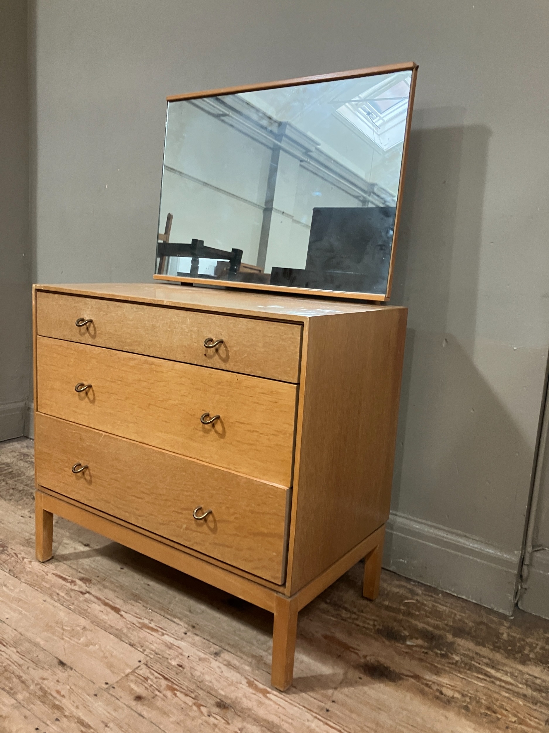 A 1960s Stag pale oak dressing chest having an adjustable mirror over three graduated drawers, on - Image 2 of 4