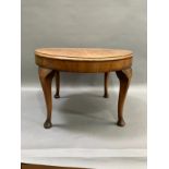A walnut quarter veneered occasional table on cabriole legs with pad feet, 60cm
