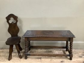 An early 20th century oak stool, rectangular and carved to the top with leaves together