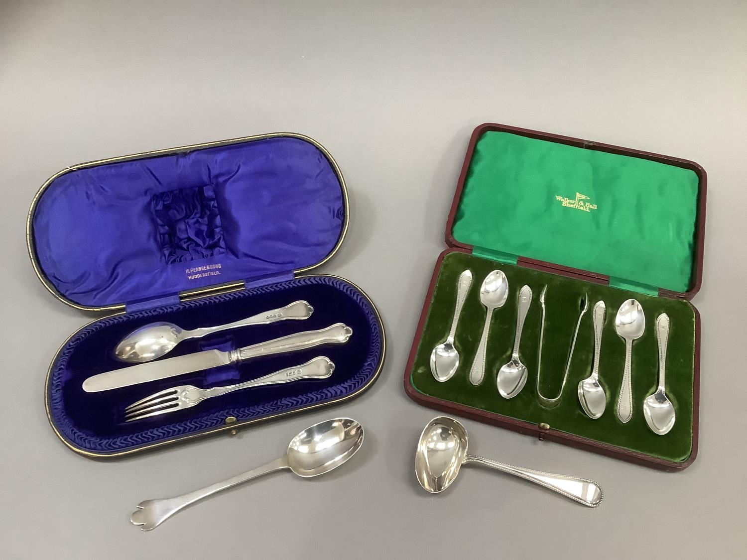 Silver pusher, child’s spoon and fork, tea knife and trefoil spoon, various dates, 20th century,