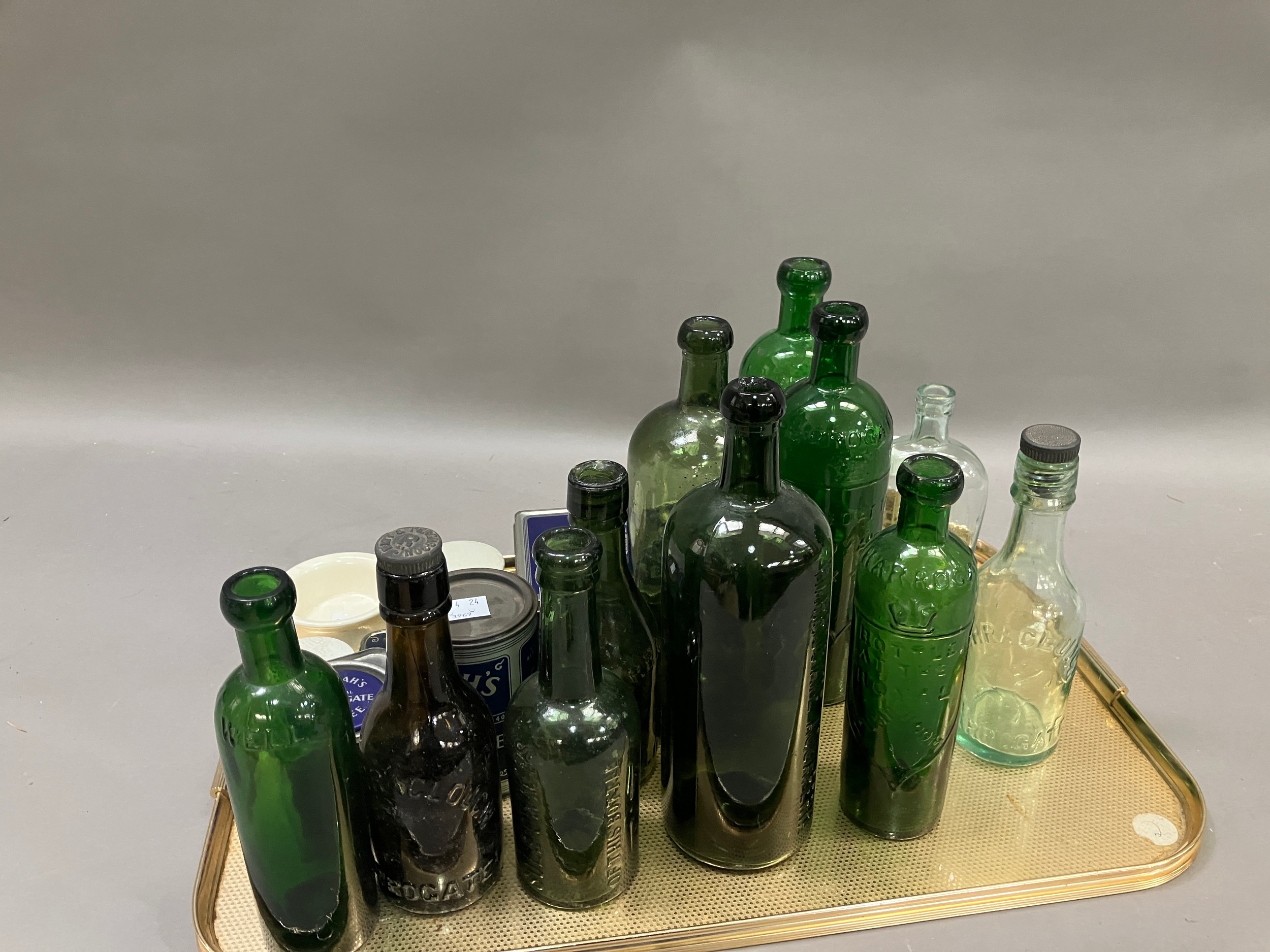 A collection of Harrogate bottles including three in green glass marked with Harrogate and a crown