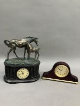 A mantel clock with moulded horse and foal figure group together with another quartz mantel clock