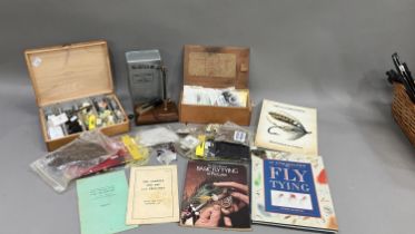 Fishing: two boxes of fly tying equipment, a fly tying vice, five fly tying books