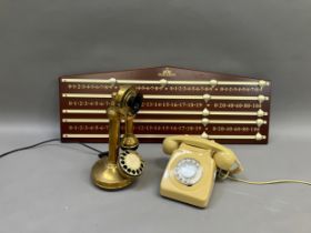 Two vintage telephones and a scoreboard
