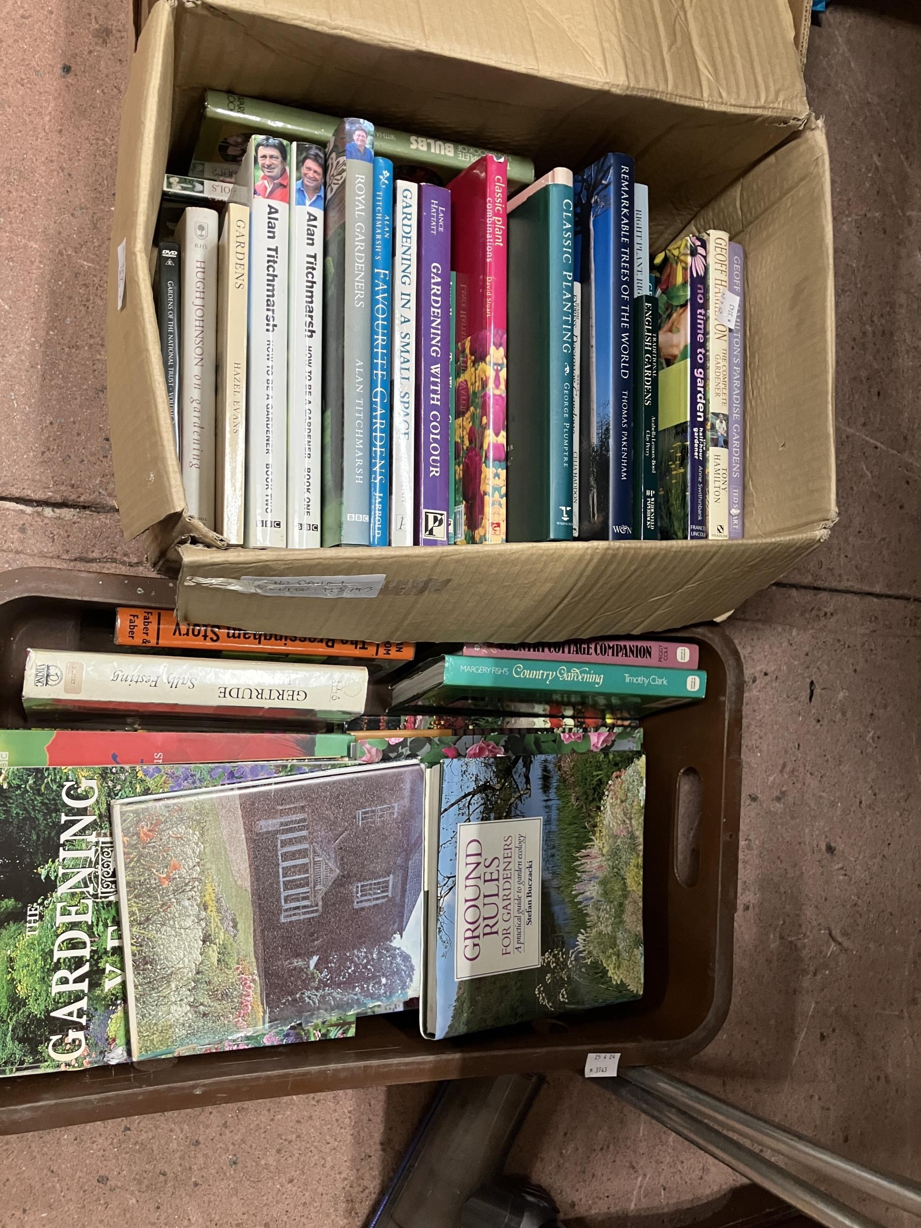 A collection of gardening reference books in two boxes