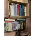 A collection of gardening reference books in two boxes