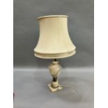 A gilt metal mounted alabaster table lamp of urn form on a square base, complete with shade, 42.