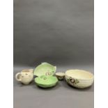 An art deco Burleigh ware sugar bowl, an early Clarice Cliff Wilkinson's jug and fruit basket and