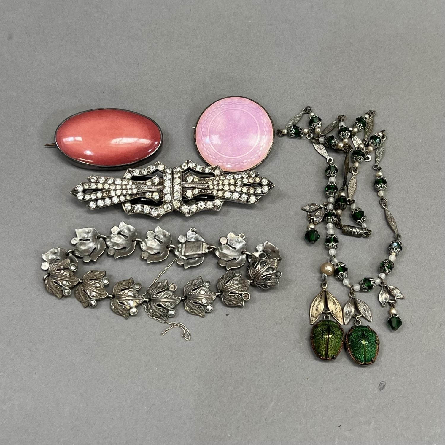 A small collection of early to mid 20th century silver jewellery including a Kensington art